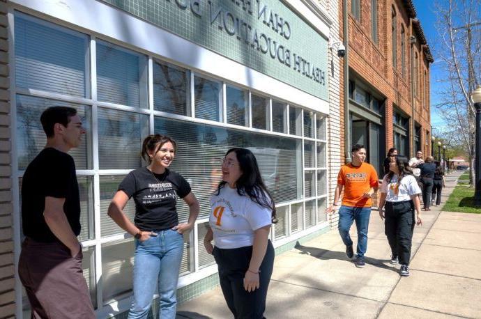 OT students talking on the sidewalk